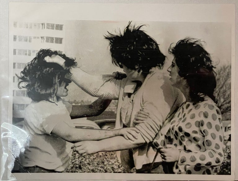 Item #4504 Press photo of a fight between teen punk girl gangs -- England, 1964. PHOTOS, PUNK, GANGS.