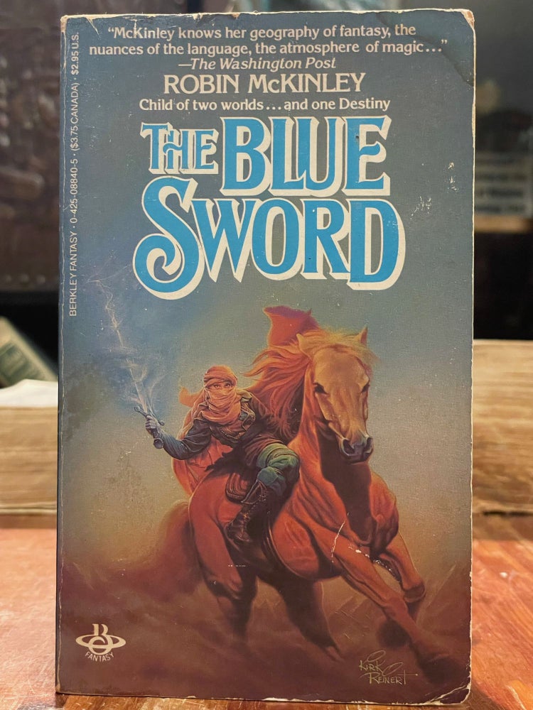 Item #4700 The Blue Sword. Robin MCKINLEY.